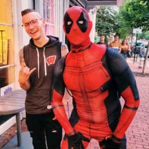 barista standing with guest in cosplay